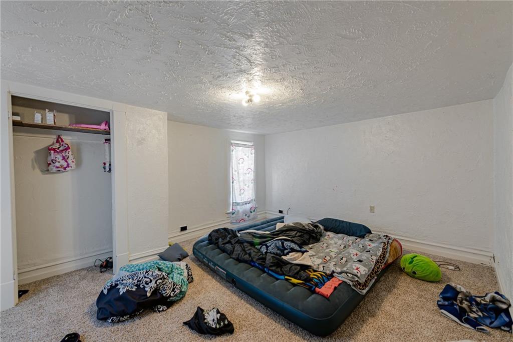 125 North Chestnut Street Butler, PA 16001 - Photo 14 of 25 a bed room with furniture and a window