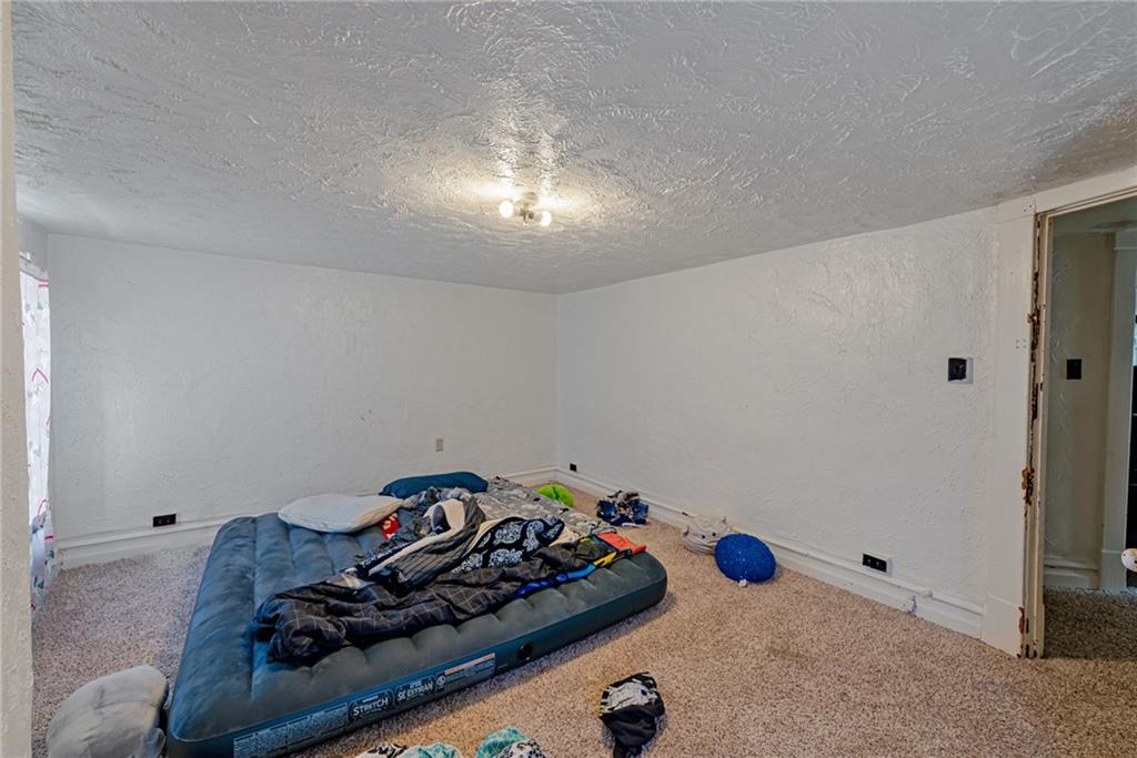 125 North Chestnut Street Butler, PA 16001 - Photo 15 of 25 a room with furniture and view of bedroom