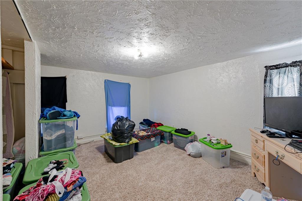 125 North Chestnut Street Butler, PA 16001 - Photo 16 of 25 a living room with furniture and a flat screen tv