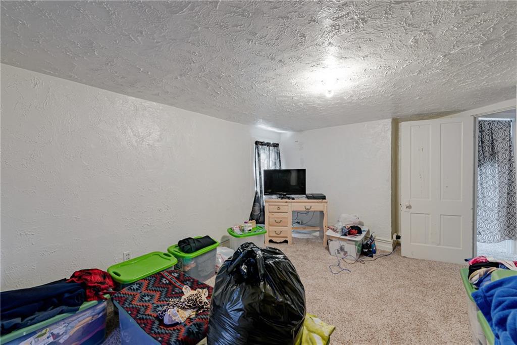 125 North Chestnut Street Butler, PA 16001 - Photo 17 of 25 a bedroom with bed and a window