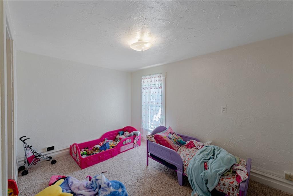 125 North Chestnut Street Butler, PA 16001 - Photo 18 of 25 a bedroom with a bed and window