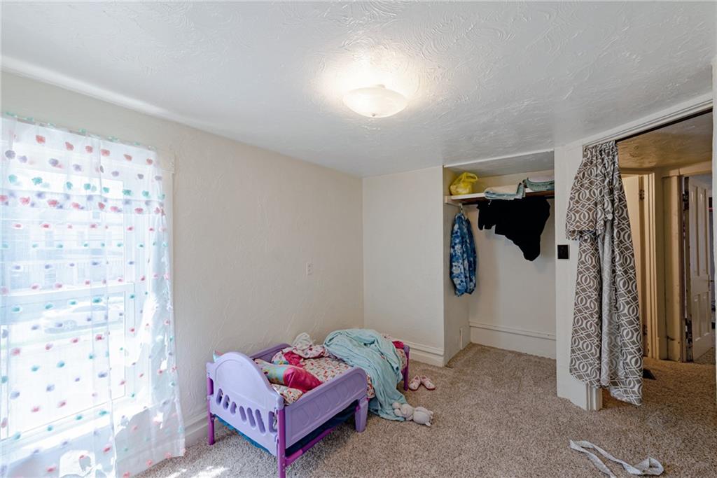 125 North Chestnut Street Butler, PA 16001 - Photo 19 of 25 a living room with furniture and a window