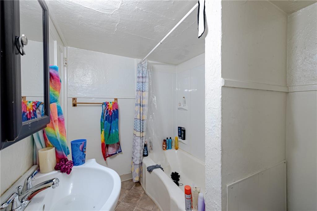 125 North Chestnut Street Butler, PA 16001 - Photo 20 of 25 a bathroom with a sink mirror vanity and toilet