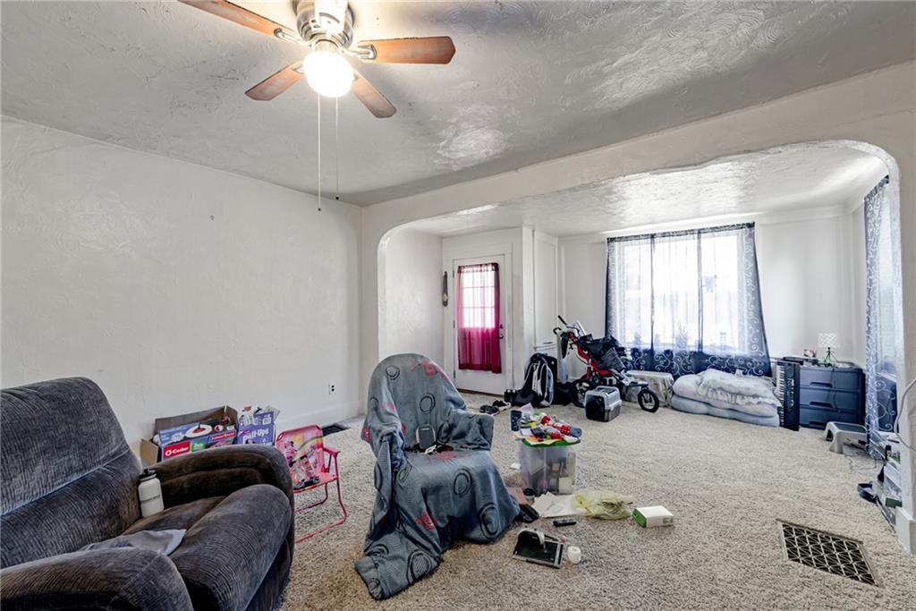 125 North Chestnut Street Butler, PA 16001 - Photo 5 of 25 a living room with furniture and a chandelier