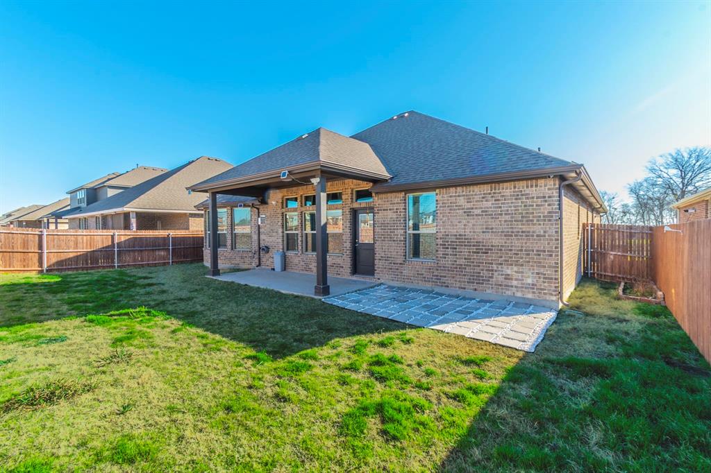 10638 Cherry Tree Way Grand Prairie, TX 76065 - Photo 33 of 39 View of the back of property featuring covered patio and plenty of yard space