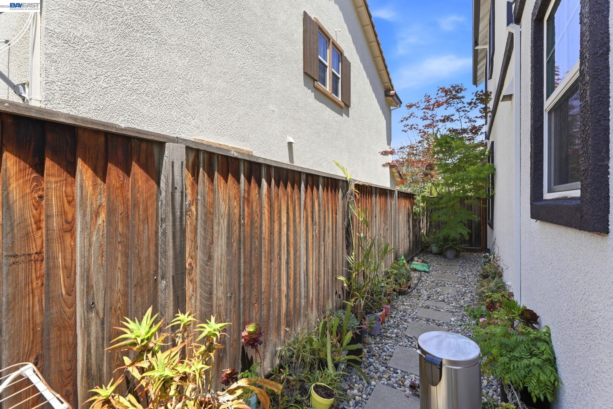 5029 Queensbury Way San Ramon, CA 94582 - Photo 40 of 58 a view of a backyard with potted plants