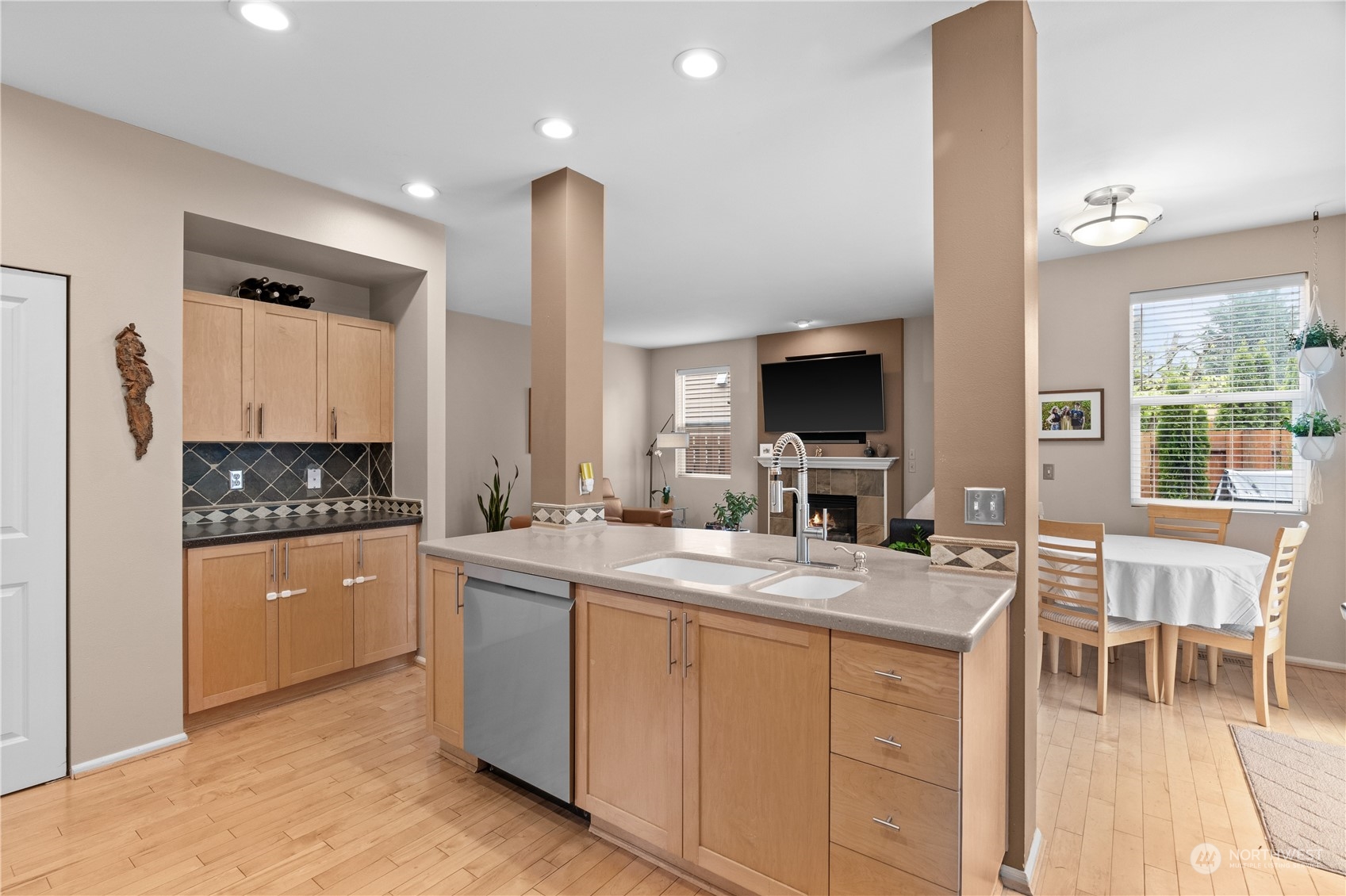 27325 Maple Ridge Way Southeast Maple Valley, WA 98038 - Photo 16 of 40 a kitchen with a sink and cabinets