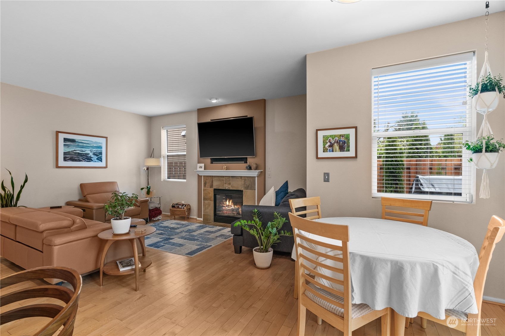27325 Maple Ridge Way Southeast Maple Valley, WA 98038 - Photo 17 of 40 a living room with furniture a fireplace and a flat screen tv
