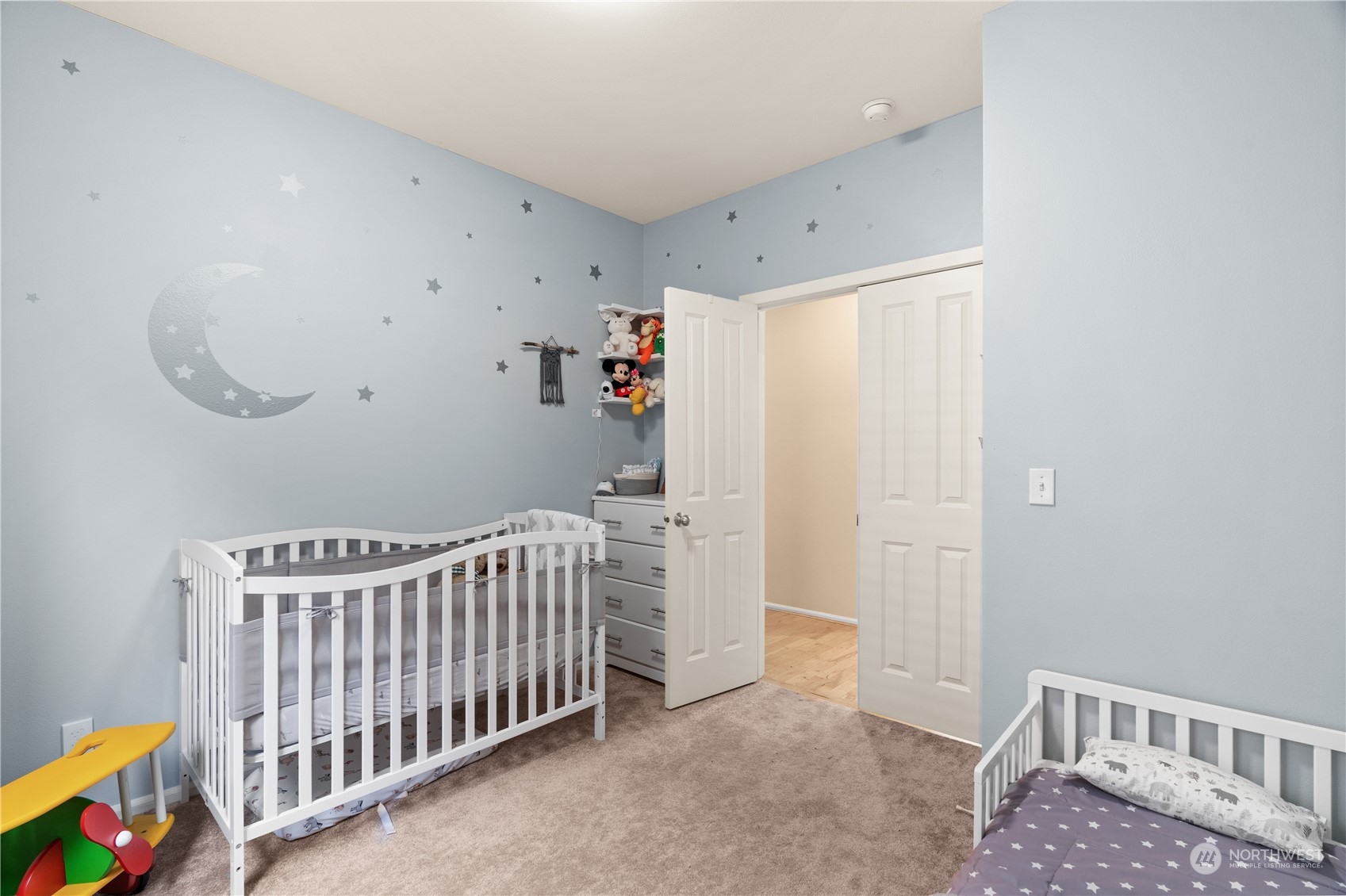 27325 Maple Ridge Way Southeast Maple Valley, WA 98038 - Photo 23 of 40 a bedroom with a bed and a window