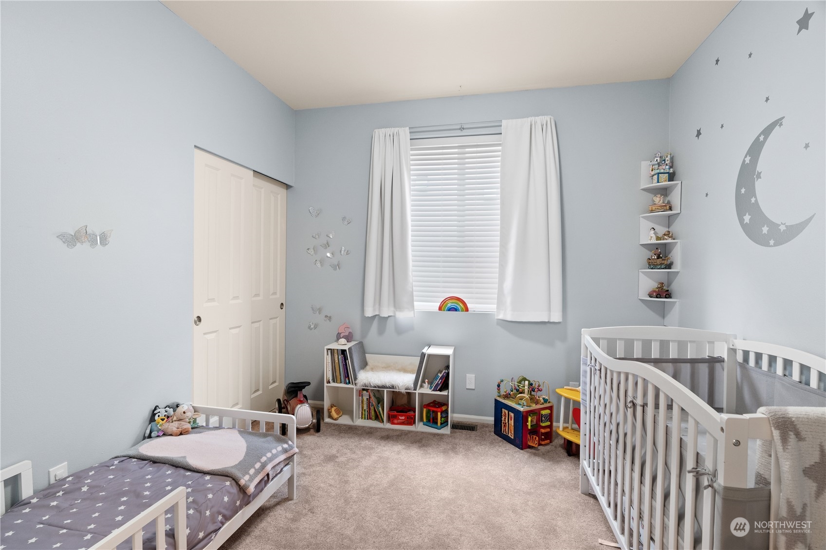 27325 Maple Ridge Way Southeast Maple Valley, WA 98038 - Photo 24 of 40 a bedroom with furniture and a window