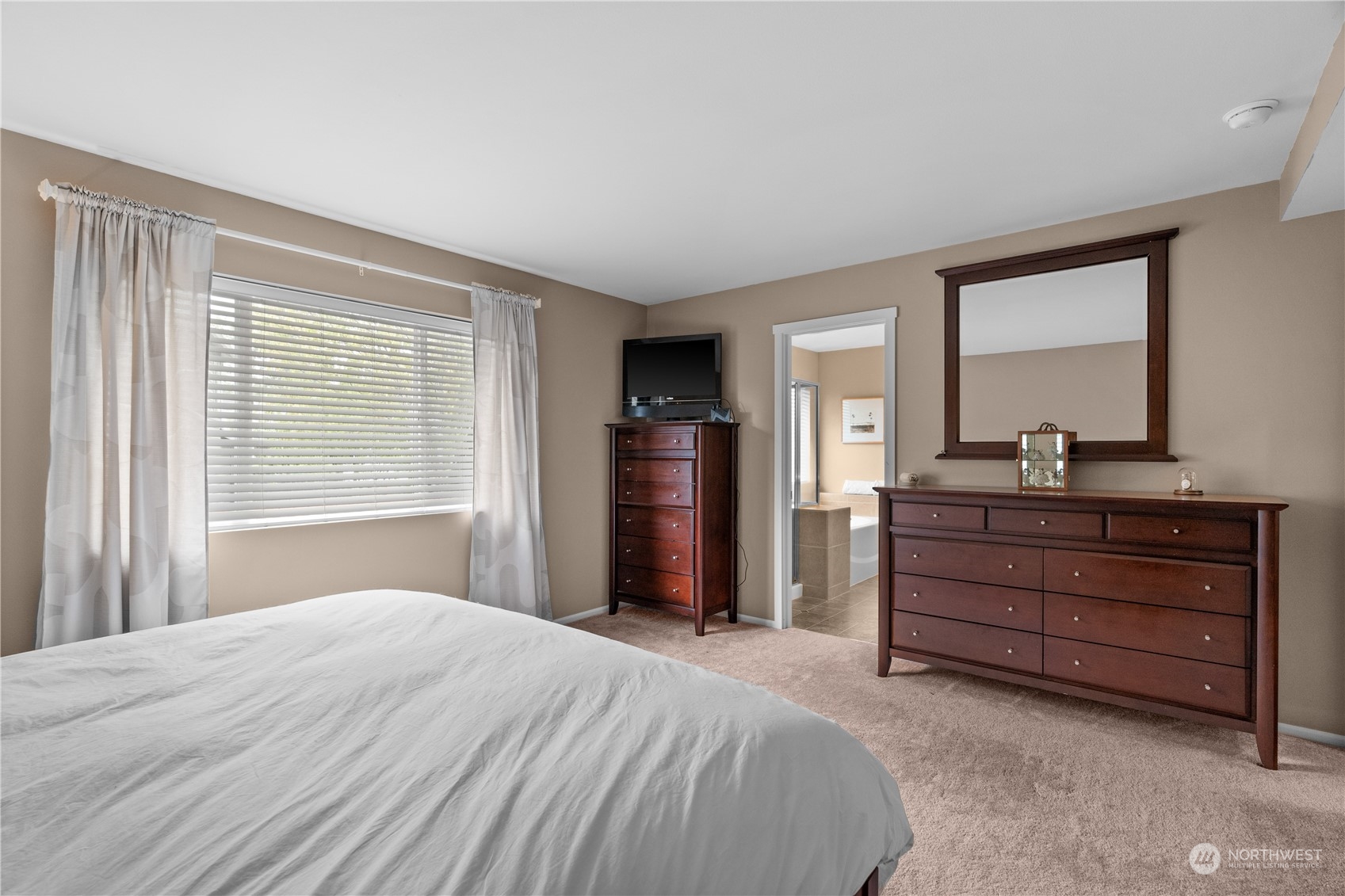 27325 Maple Ridge Way Southeast Maple Valley, WA 98038 - Photo 25 of 40 a bedroom with a bed and a dresser