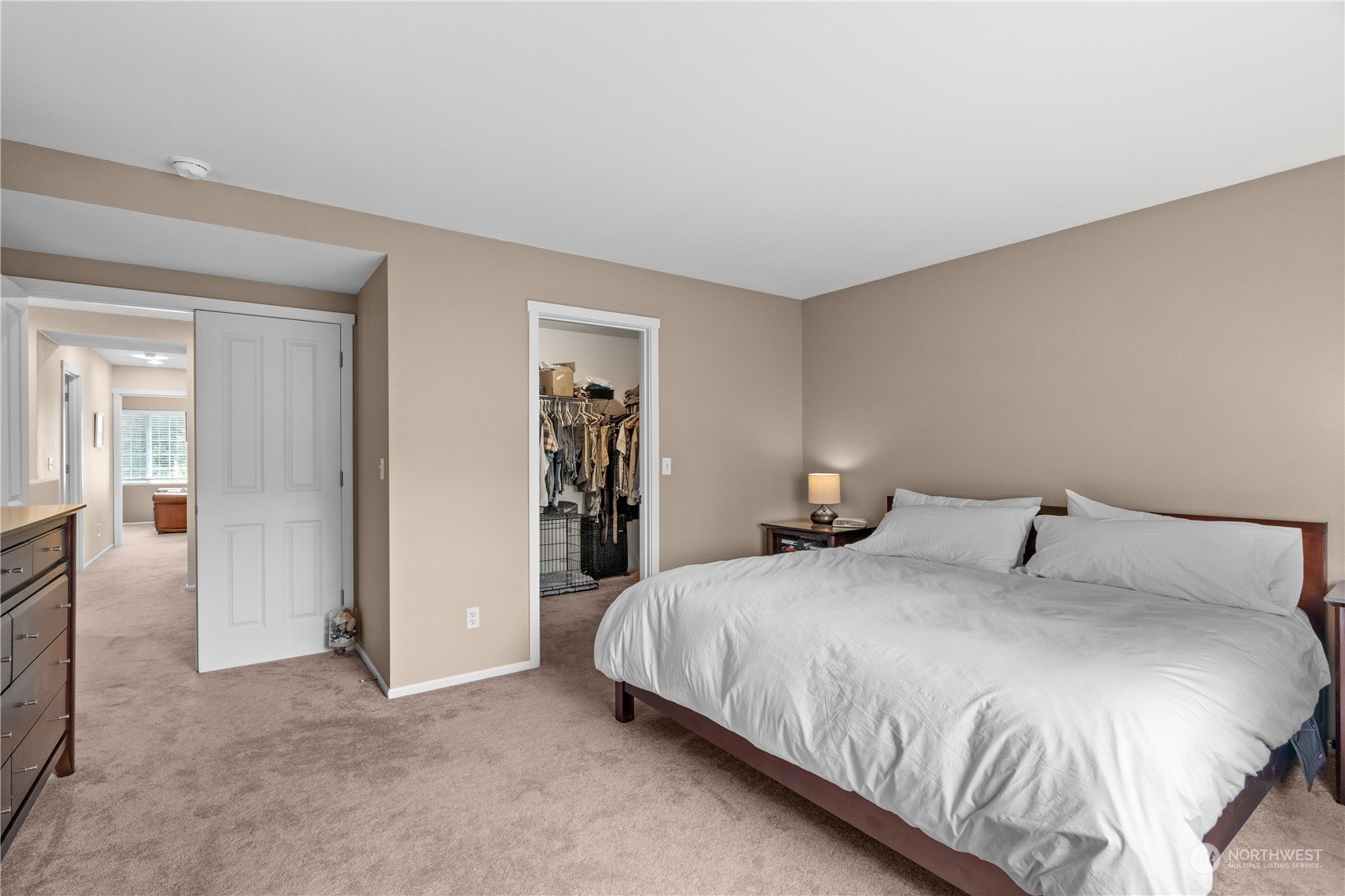 27325 Maple Ridge Way Southeast Maple Valley, WA 98038 - Photo 26 of 40 a bedroom with a bed and walk in closet