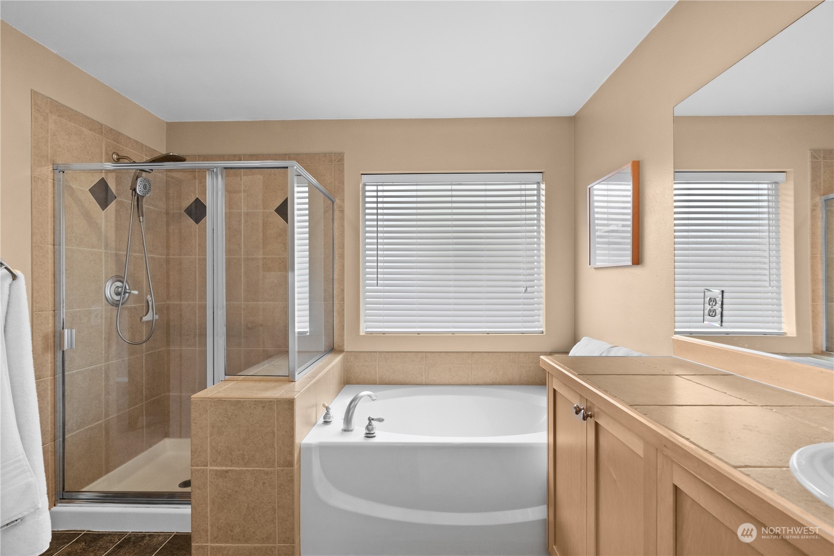 27325 Maple Ridge Way Southeast Maple Valley, WA 98038 - Photo 28 of 40 a bathroom with a granite countertop tub shower and sink