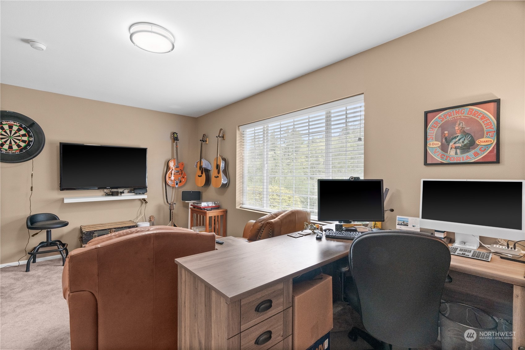 27325 Maple Ridge Way Southeast Maple Valley, WA 98038 - Photo 29 of 40 a view of a workspace with furniture and a flat screen tv