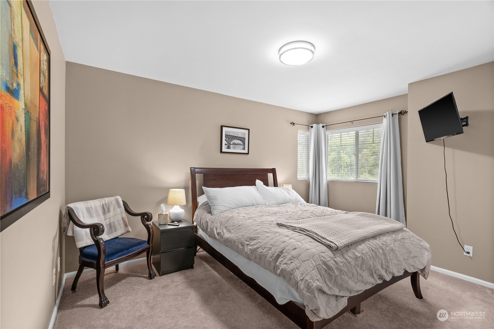 27325 Maple Ridge Way Southeast Maple Valley, WA 98038 - Photo 33 of 40 a bedroom with a bed and a flat screen tv