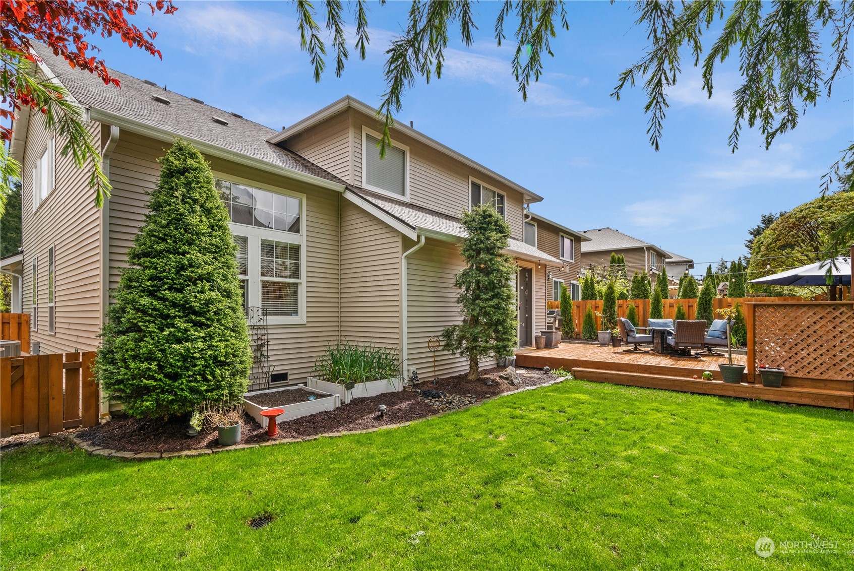 27325 Maple Ridge Way Southeast Maple Valley, WA 98038 - Photo 36 of 40 a view of a house with a yard and sitting area