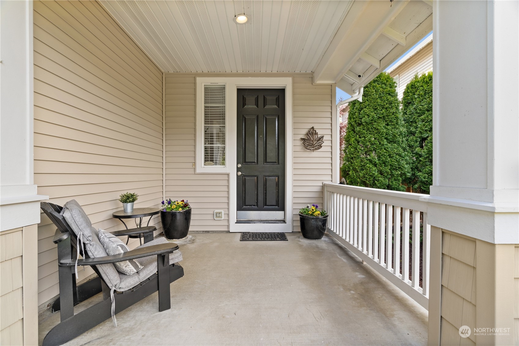 27325 Maple Ridge Way Southeast Maple Valley, WA 98038 - Photo 4 of 40 a porch with a bench and a potted plant
