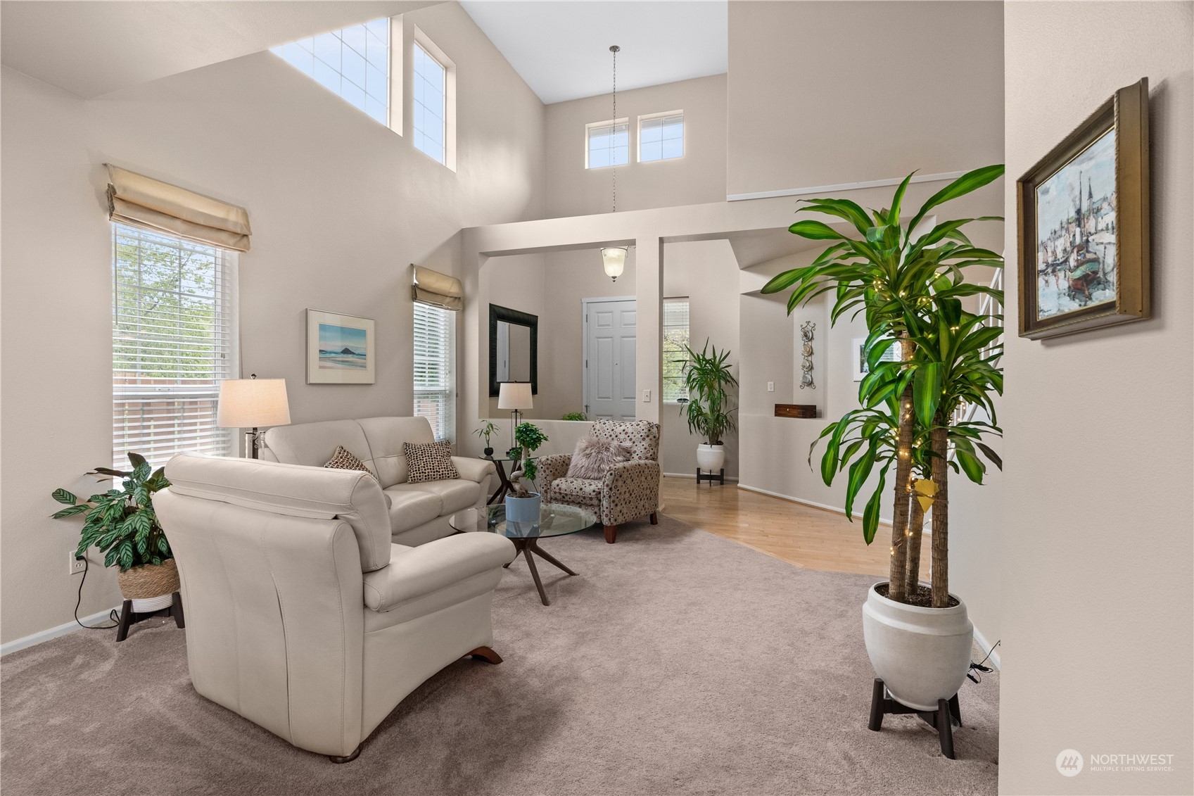 27325 Maple Ridge Way Southeast Maple Valley, WA 98038 - Photo 9 of 40 a living room with furniture potted plant and a window