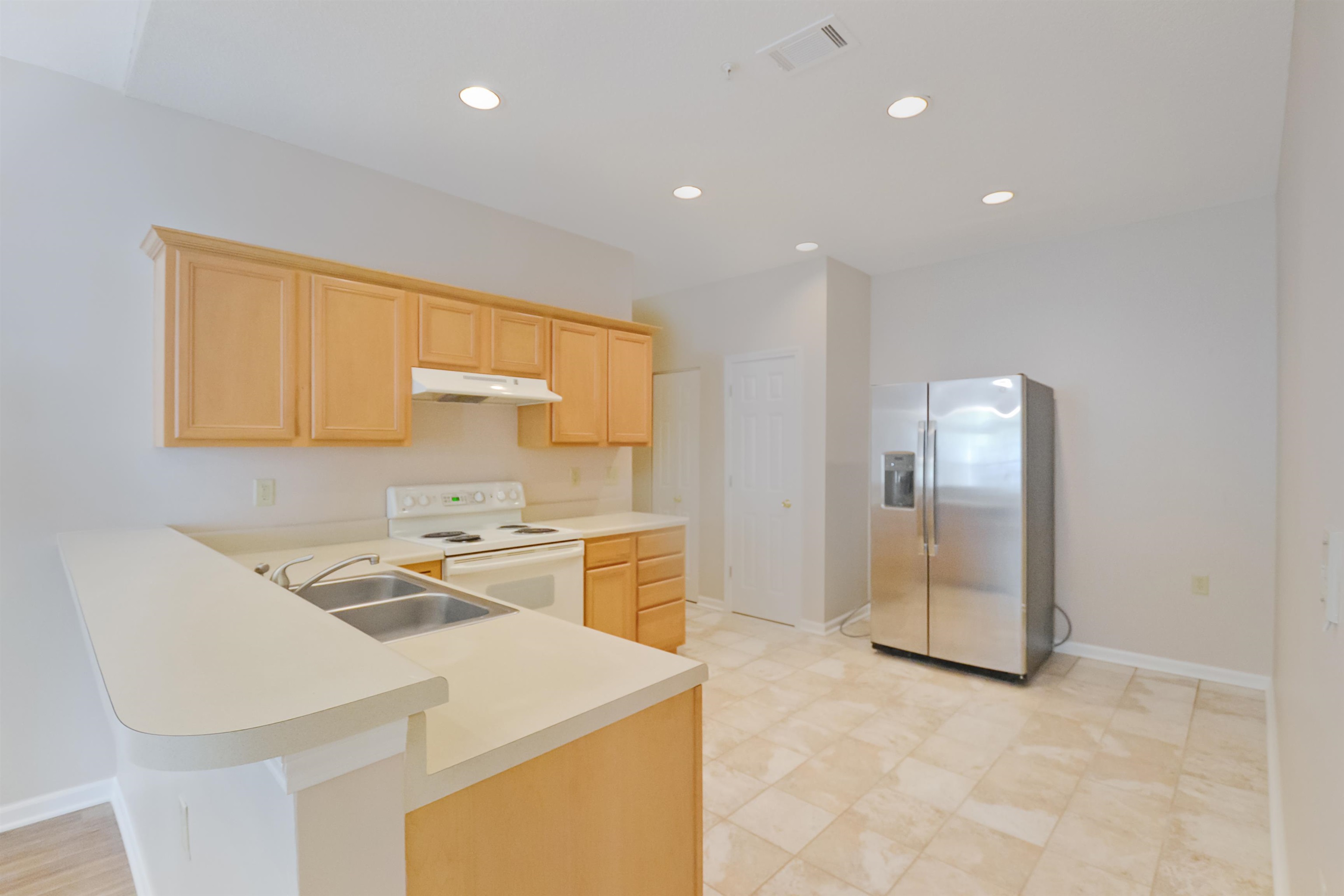 1201 Oak Timber Circle, Unit 29 Collierville, TN 38017 - Photo 13 of 32 a kitchen that has a sink cabinets and wooden floor