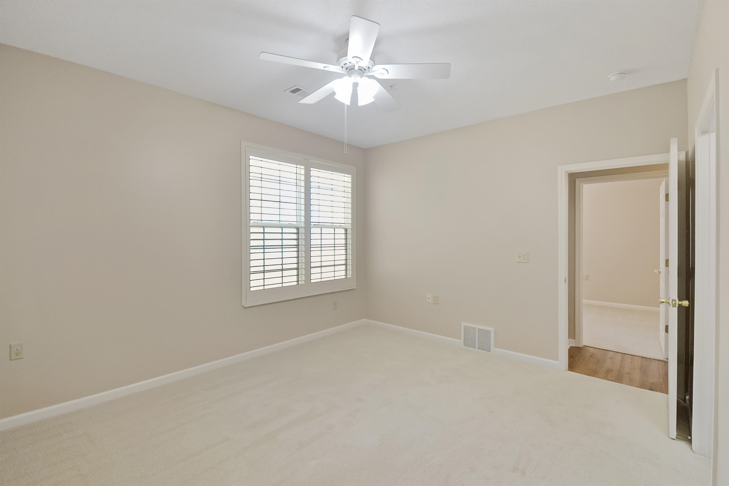 1201 Oak Timber Circle, Unit 29 Collierville, TN 38017 - Photo 13 of 32 wooden floor in an empty room with a window