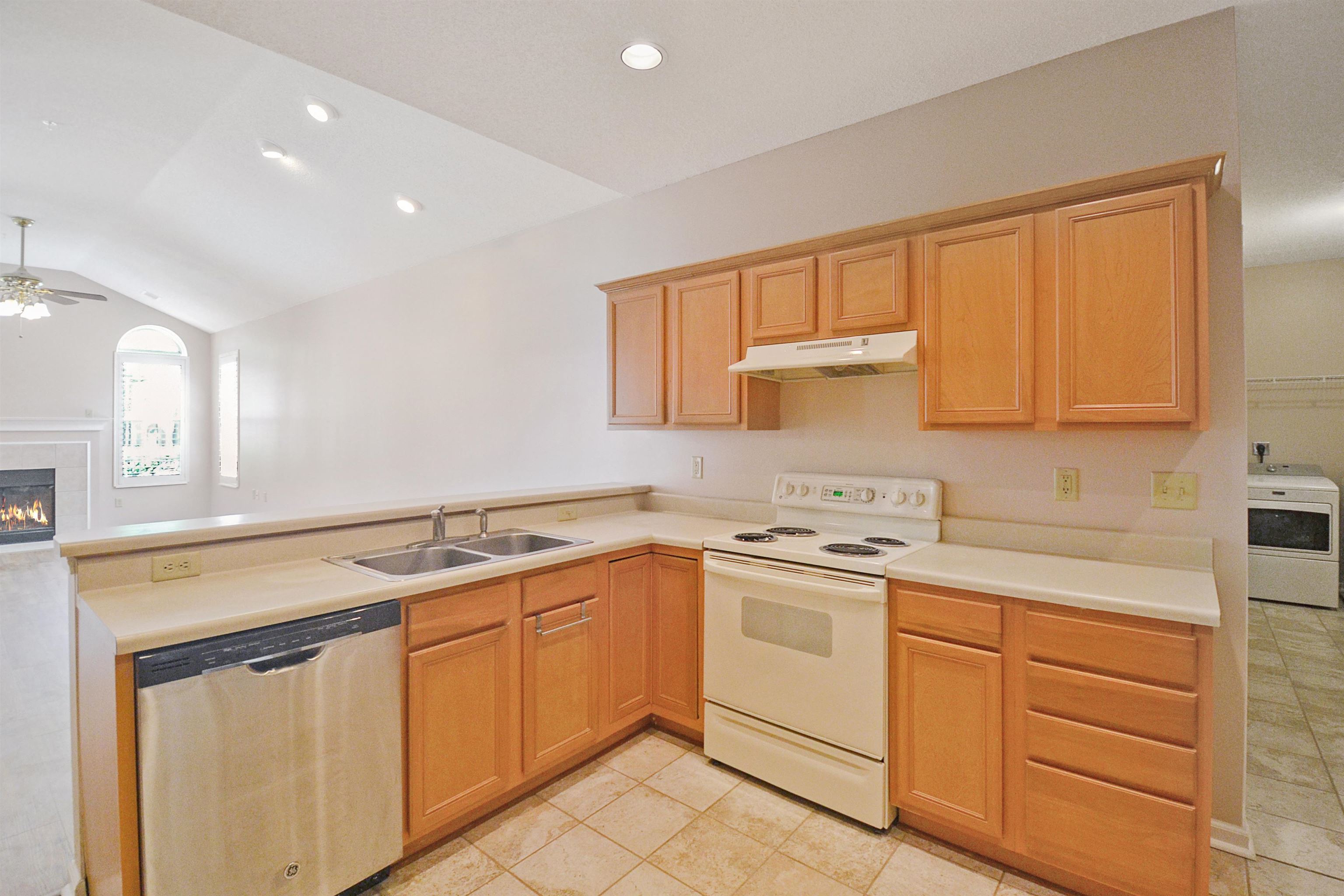 1201 Oak Timber Circle, Unit 29 Collierville, TN 38017 - Photo 15 of 32 a kitchen with white cabinets appliances and a sink