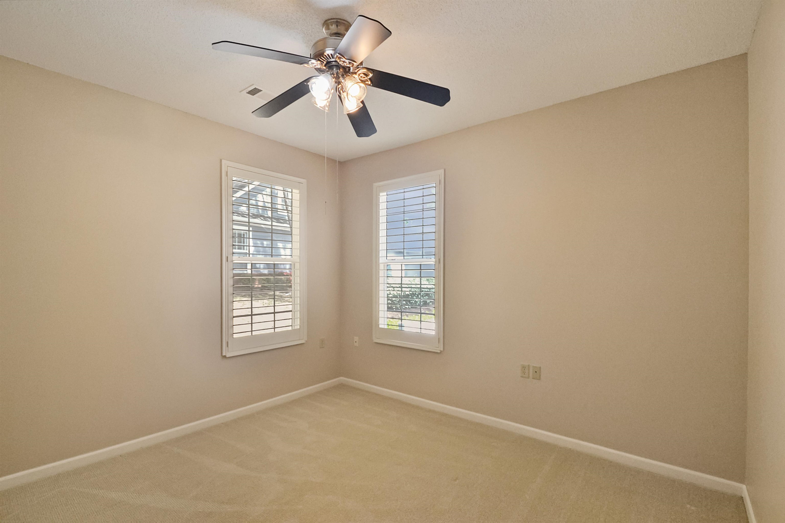 1201 Oak Timber Circle, Unit 29 Collierville, TN 38017 - Photo 18 of 32 an empty room with windows and fan