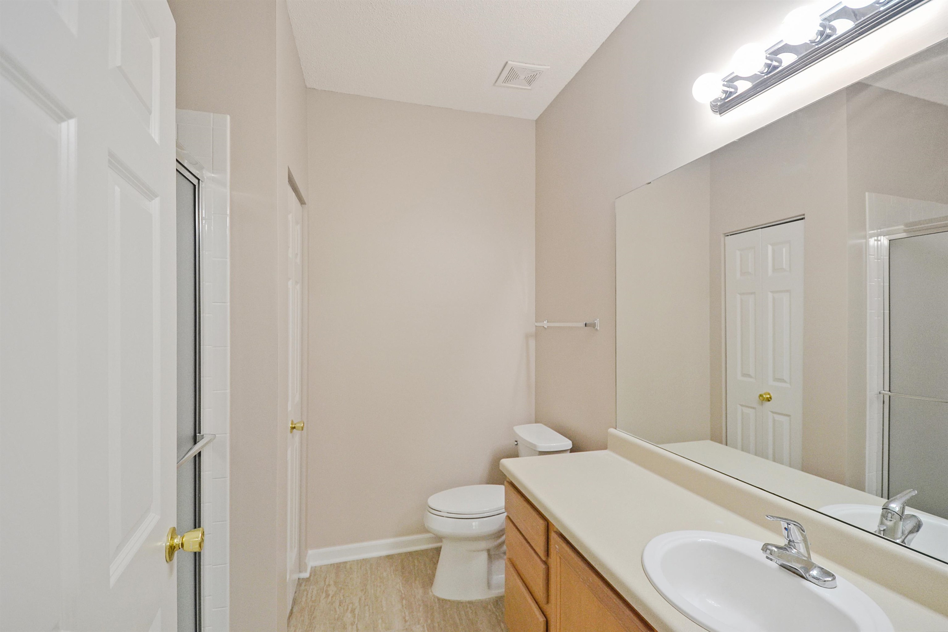 1201 Oak Timber Circle, Unit 29 Collierville, TN 38017 - Photo 23 of 32 a bathroom with a sink a toilet and shower