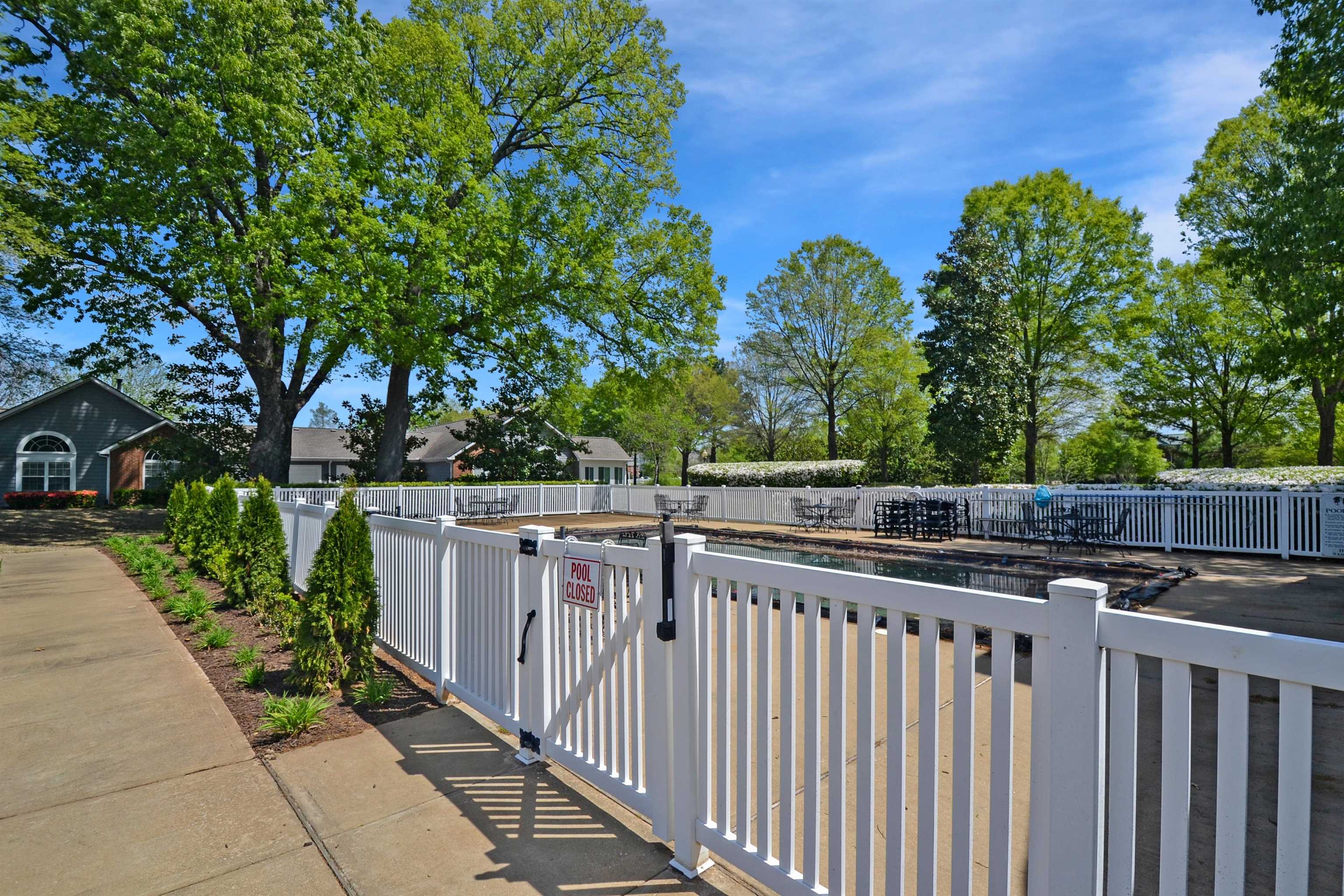 1201 Oak Timber Circle, Unit 29 Collierville, TN 38017 - Photo 25 of 32 a view of a pathway with a wrought fence