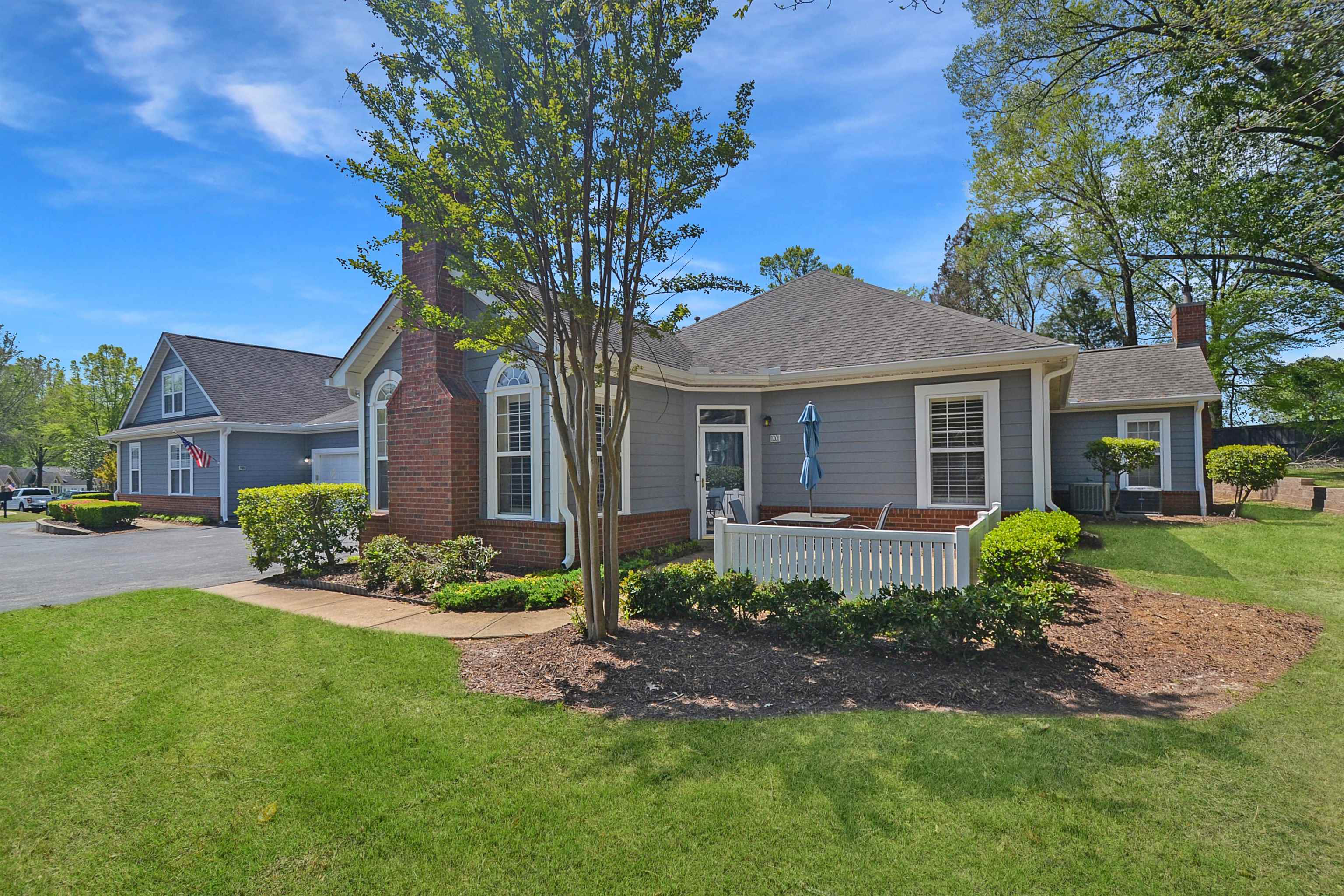 1201 Oak Timber Circle, Unit 29 Collierville, TN 38017 - Photo 3 of 32 a front view of a house with garden