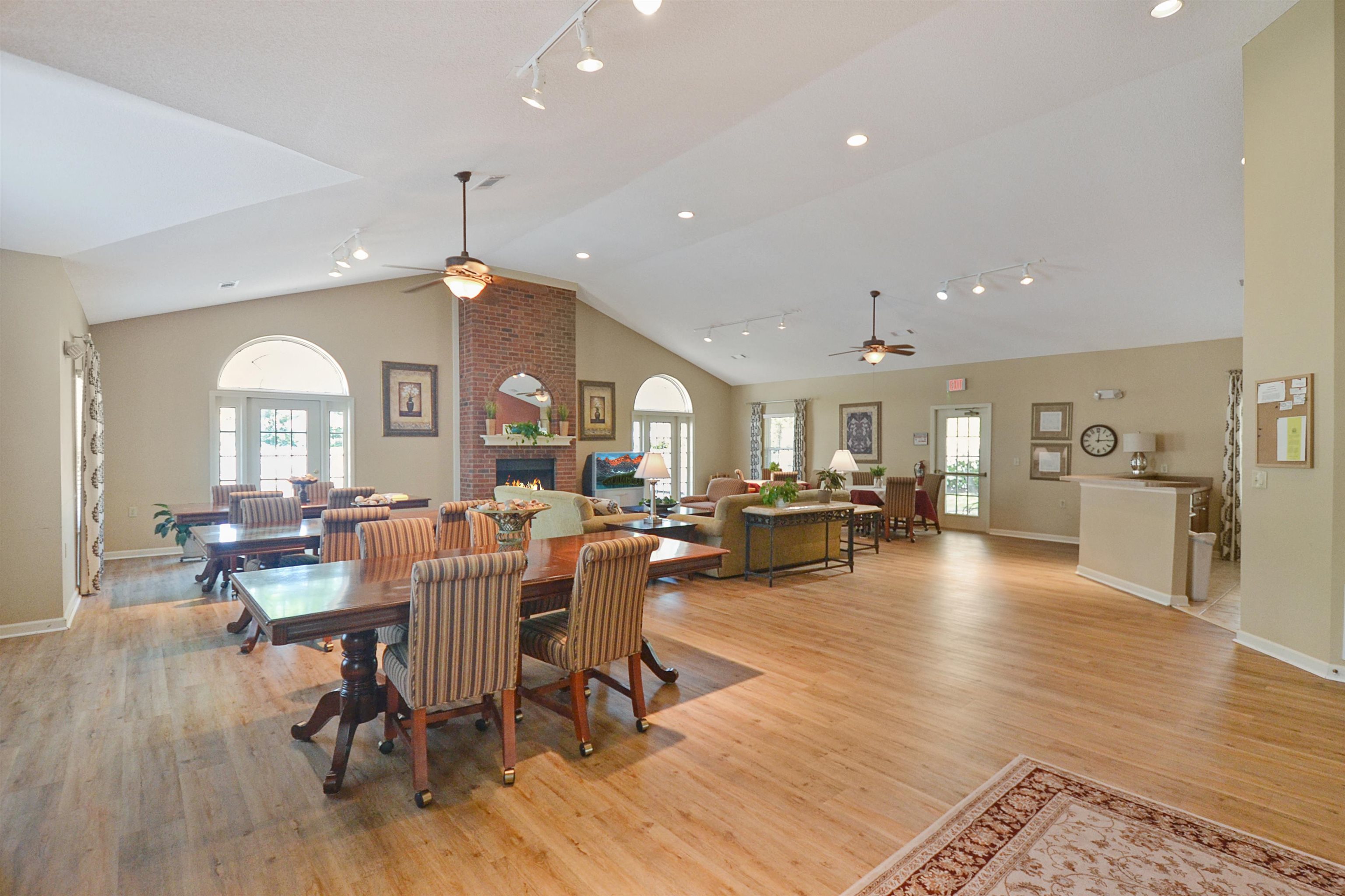1201 Oak Timber Circle, Unit 29 Collierville, TN 38017 - Photo 32 of 32 a view of a dining hall with couches and dining table with wooden floor