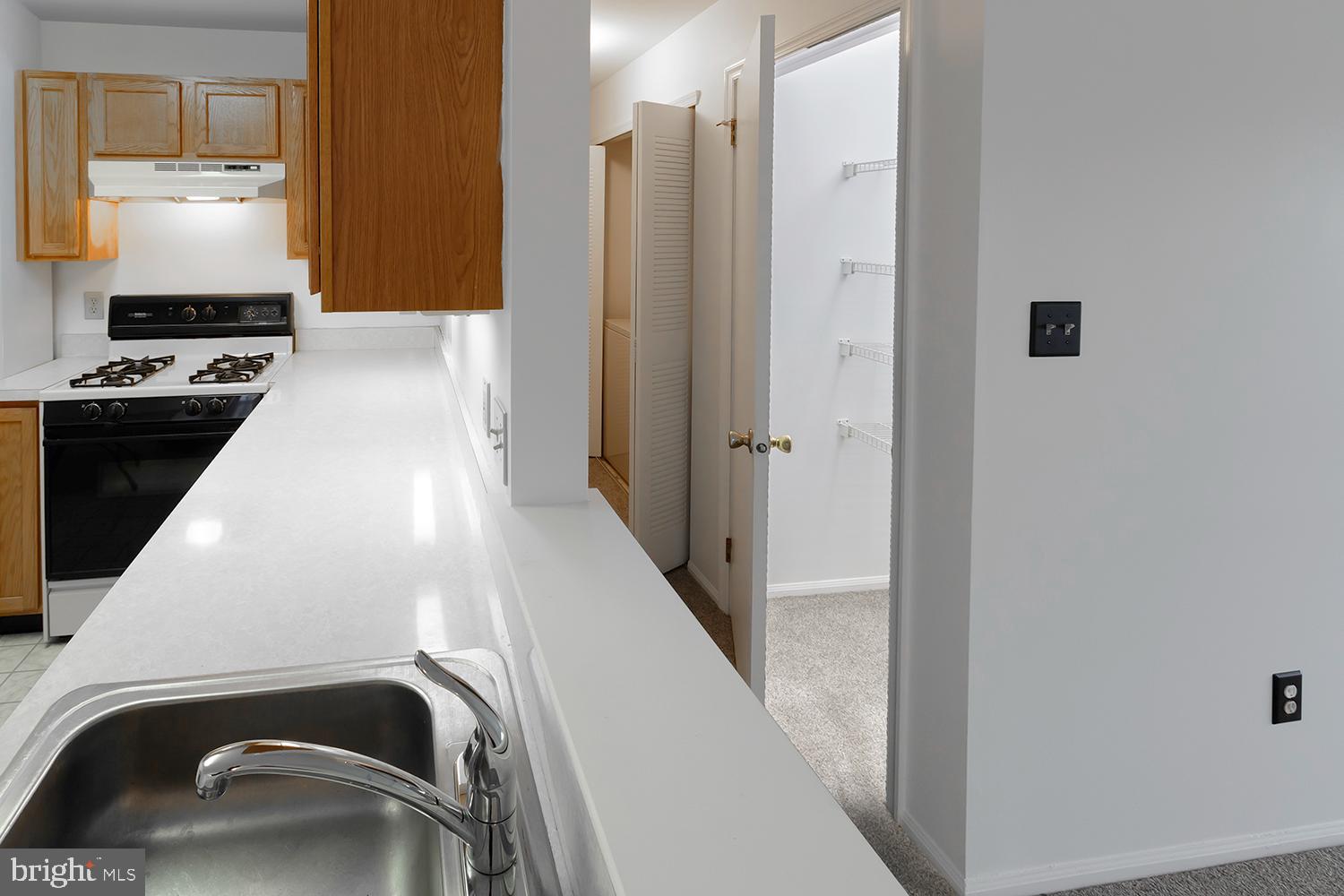 1602 Squirrel Road Marlton, NJ 08053 - Photo 16 of 21 a view of a kitchen with a sink cabinets and a refrigerator