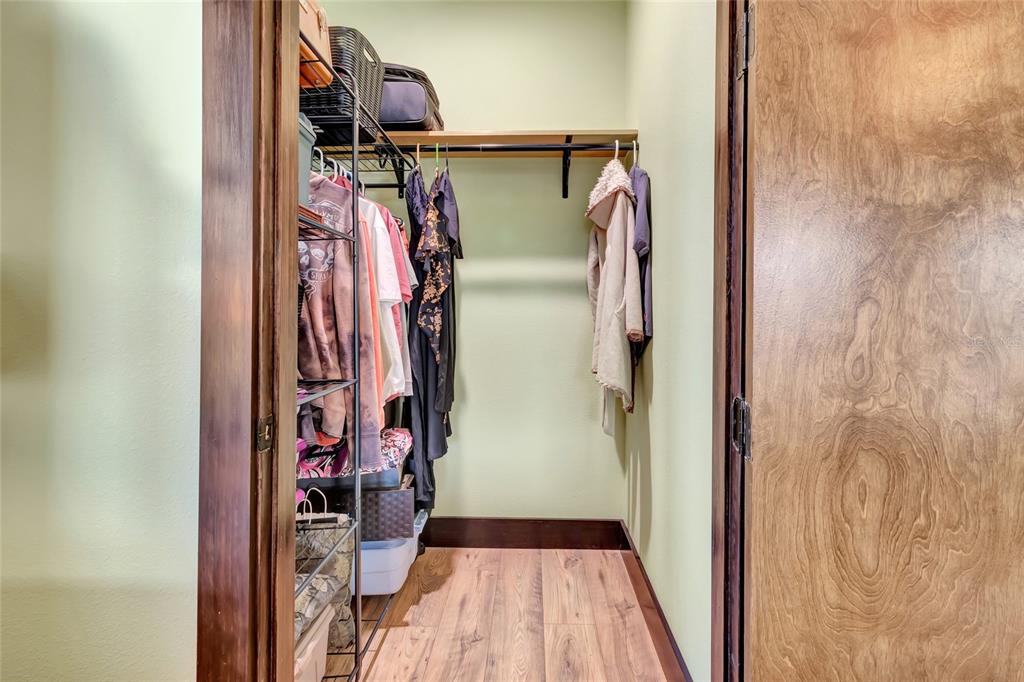 7330 Crabgrass Road St. Cloud, FL 34773 - Photo 28 of 60 a view of walk in closet with clothes