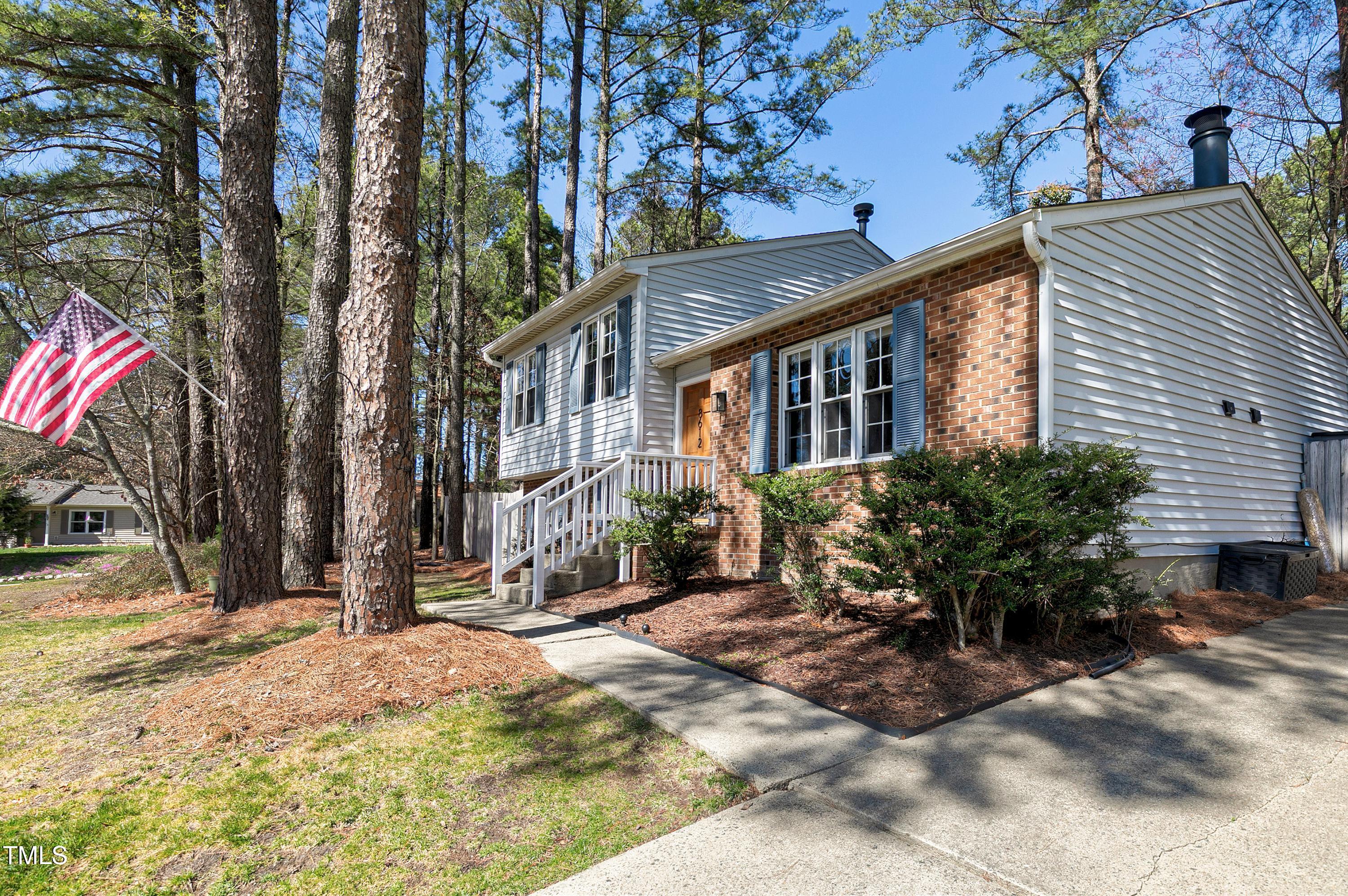 8612 Keegan Court Raleigh, NC 27613 - Photo 3 of 31 a view of a house with a yard