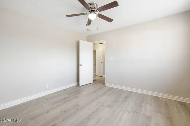 a bathroom with a sink a mirror and shower