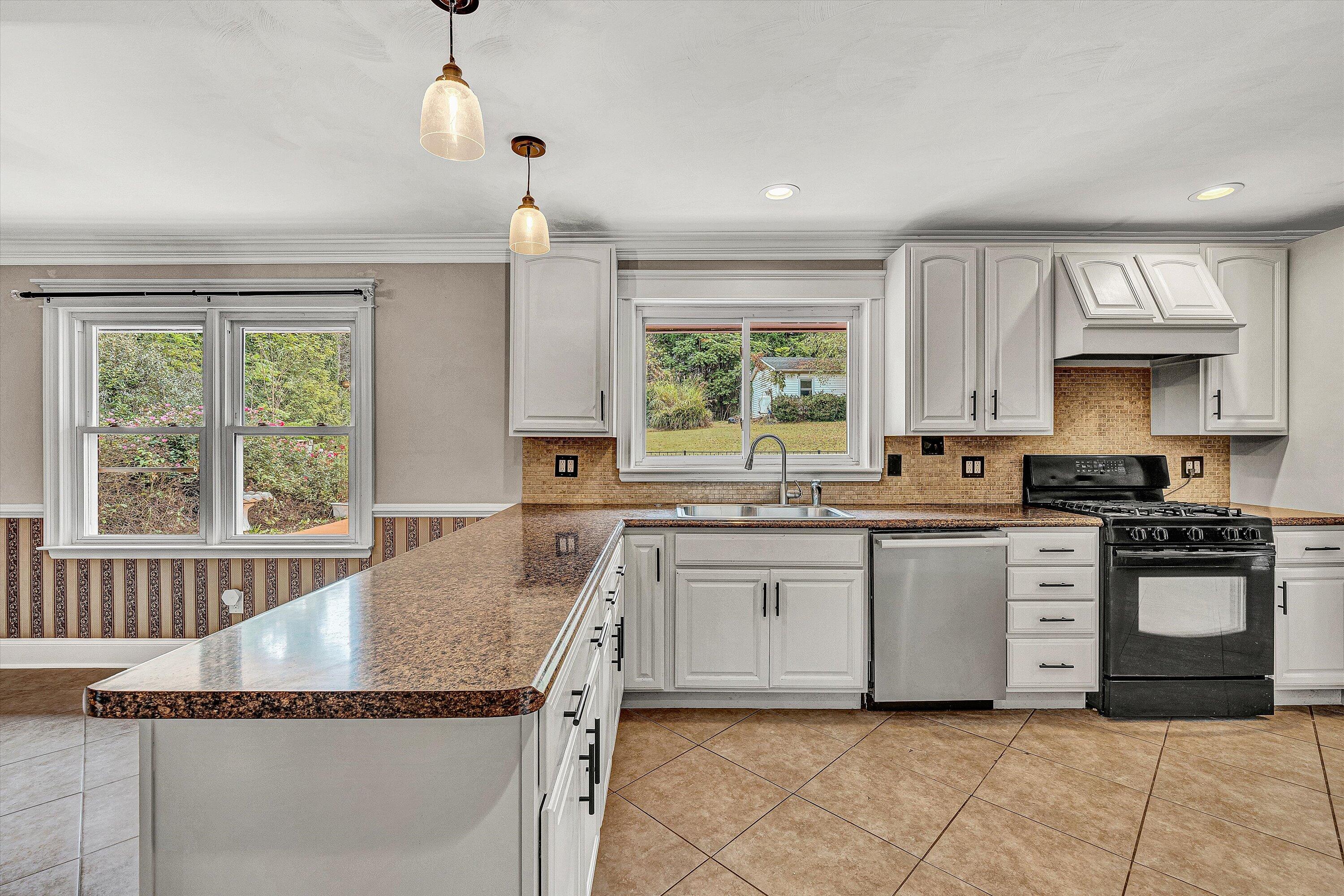 83 Springview Court Troutville, VA 24175 - Photo 12 of 74 a kitchen with granite countertop a sink window and cabinets