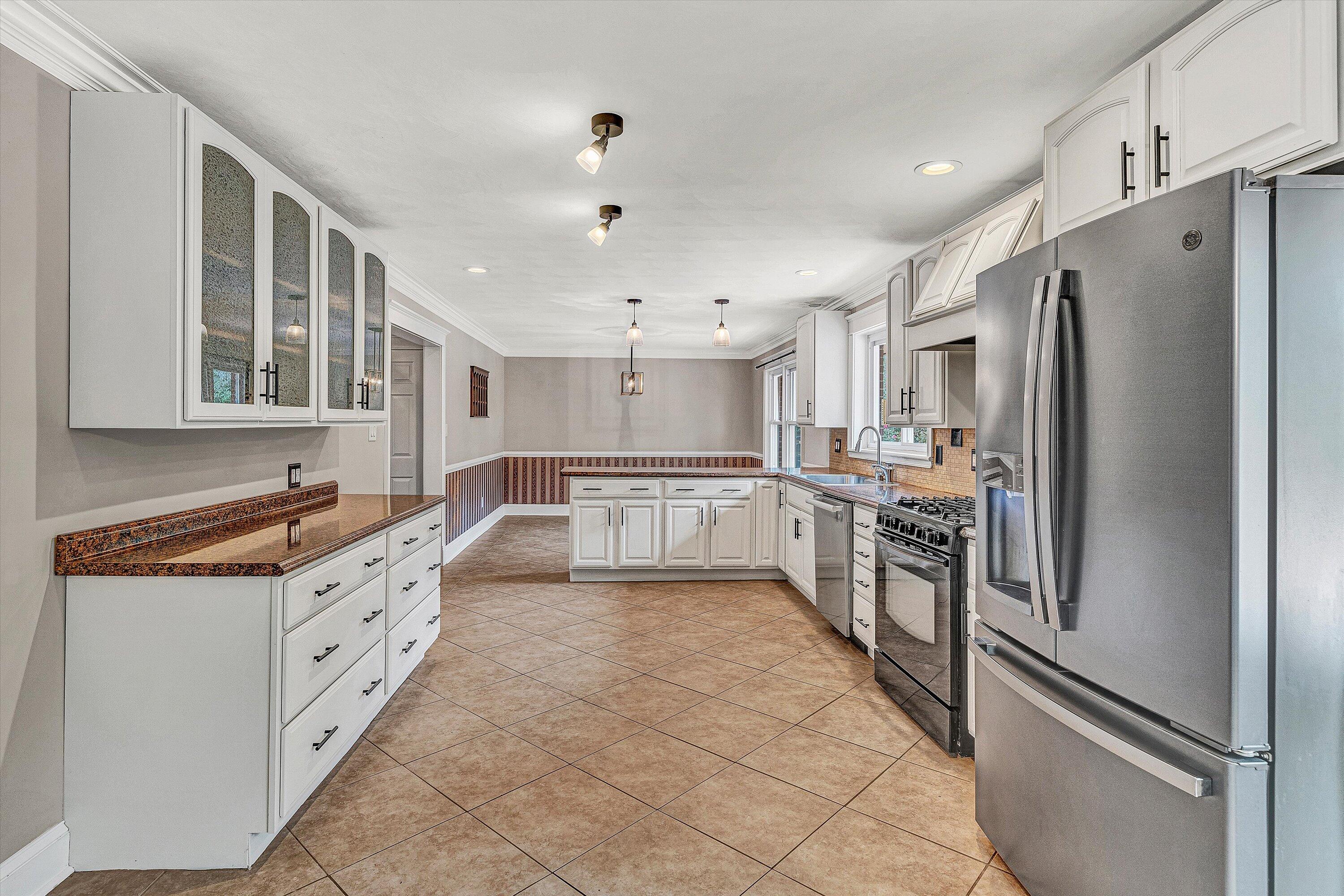 83 Springview Court Troutville, VA 24175 - Photo 14 of 74 a large kitchen with stainless steel appliances a refrigerator and a stove top oven