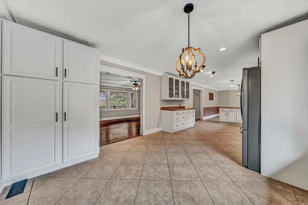 a view of workspace with wooden floor and windows