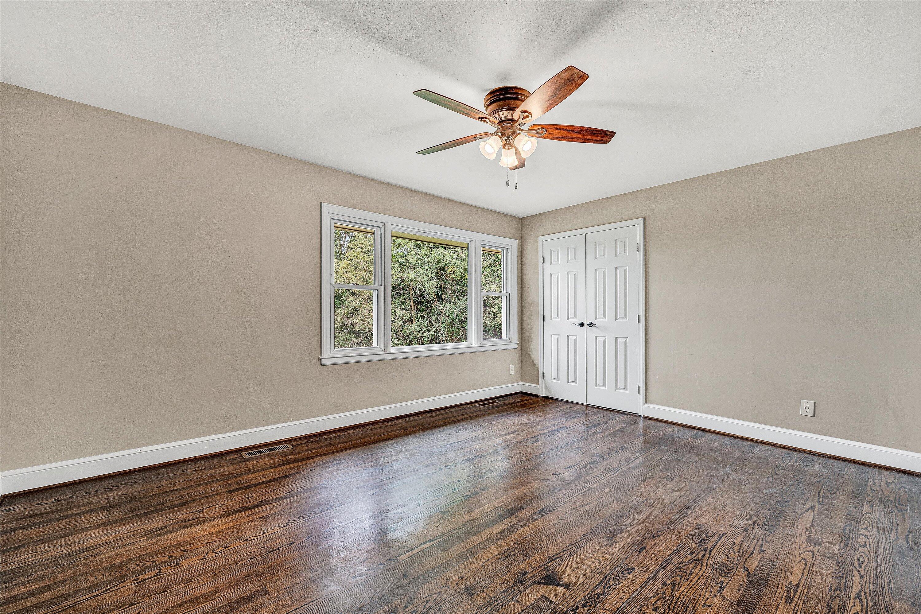 83 Springview Court Troutville, VA 24175 - Photo 17 of 74 a view of an empty room with wooden floor and a window