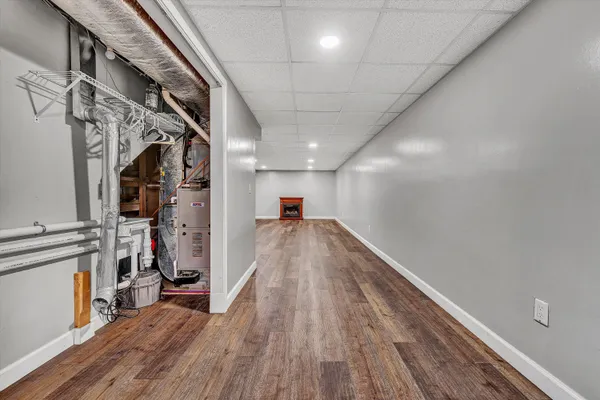 a aerial view of a house with a yard basket ball court and outdoor seating