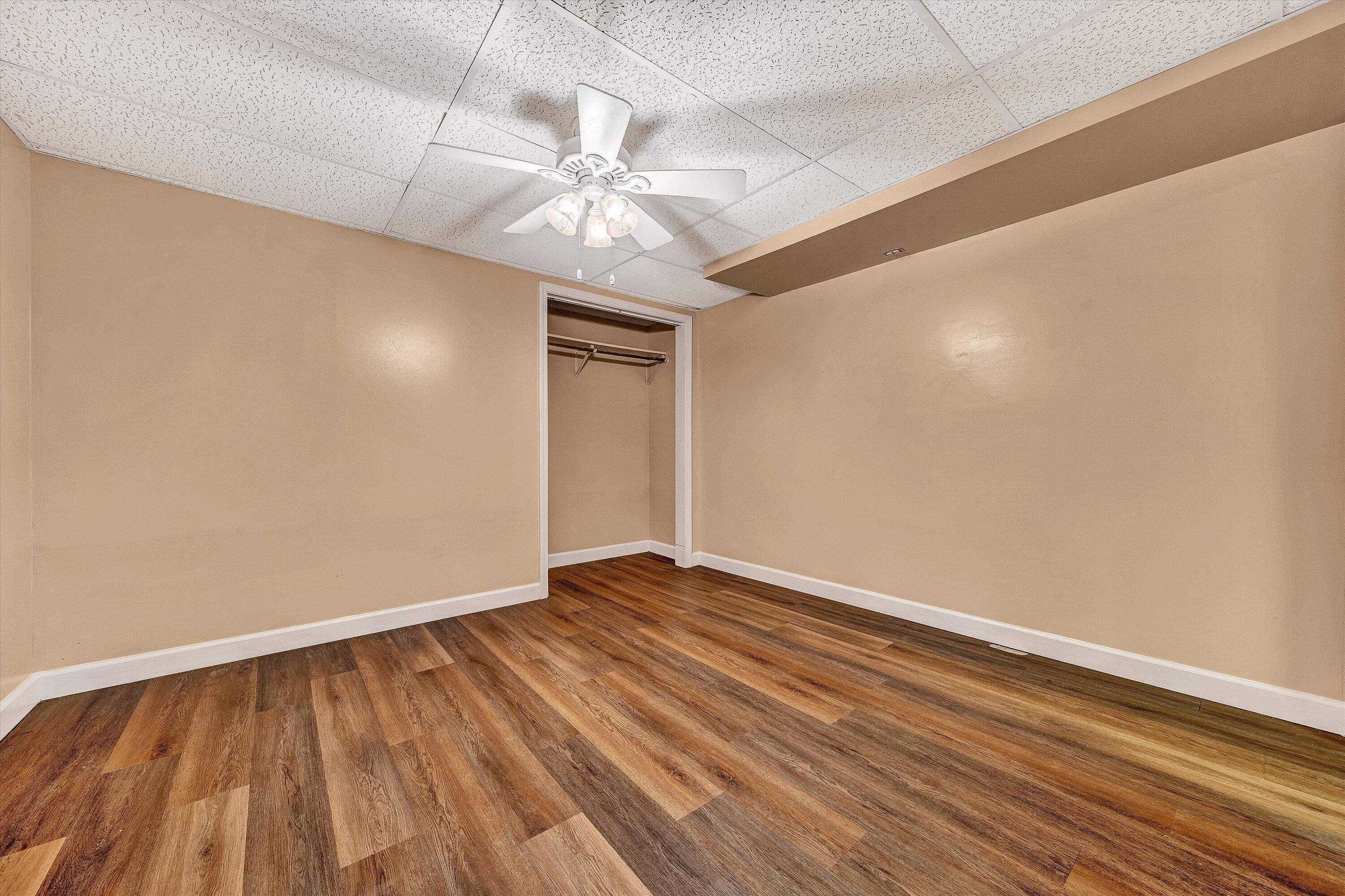 83 Springview Court Troutville, VA 24175 - Photo 45 of 74 a view of an empty room with wooden floor and a ceiling fan