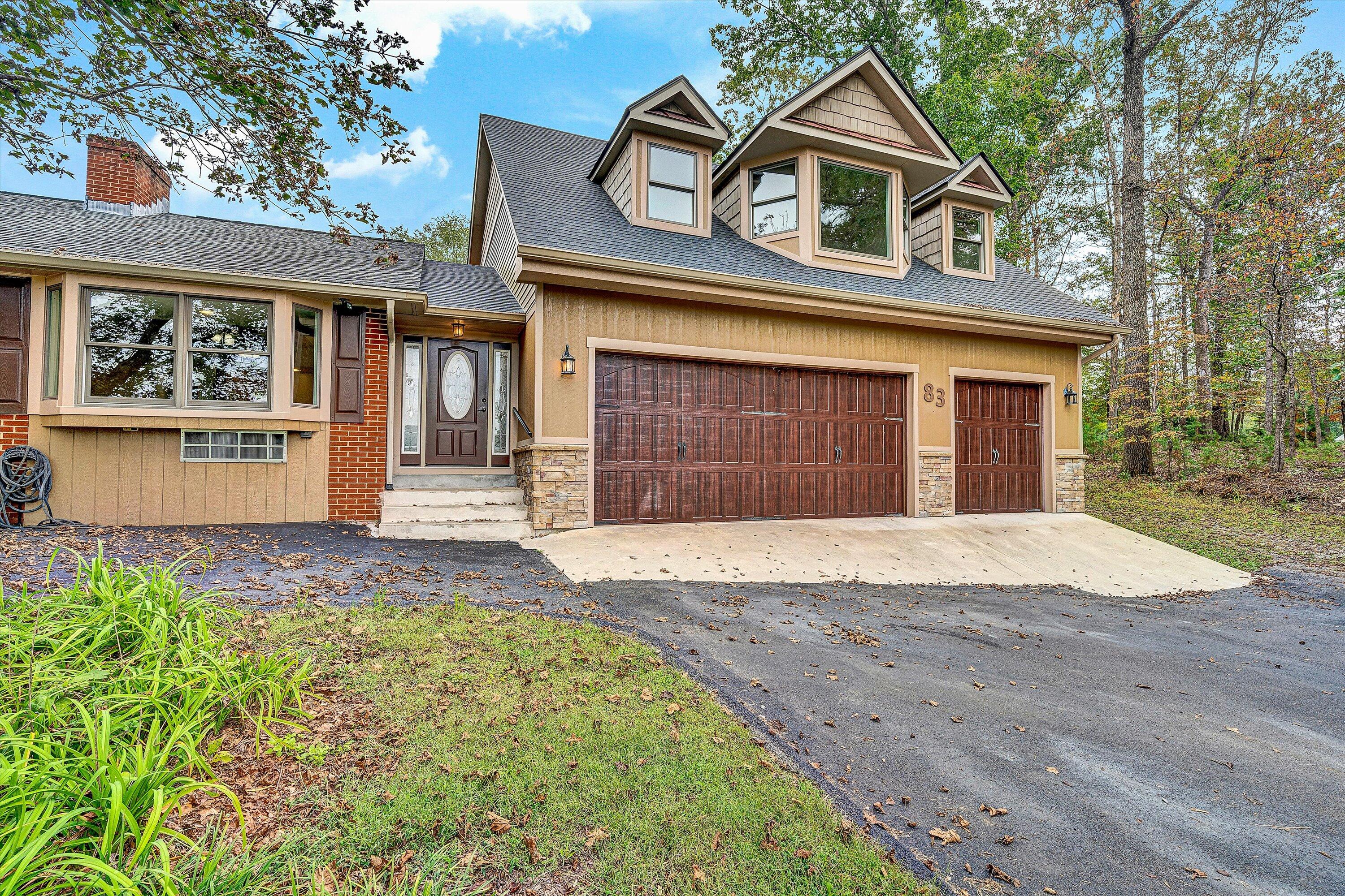83 Springview Court Troutville, VA 24175 - Photo 61 of 74 a front view of a house with a yard and garage