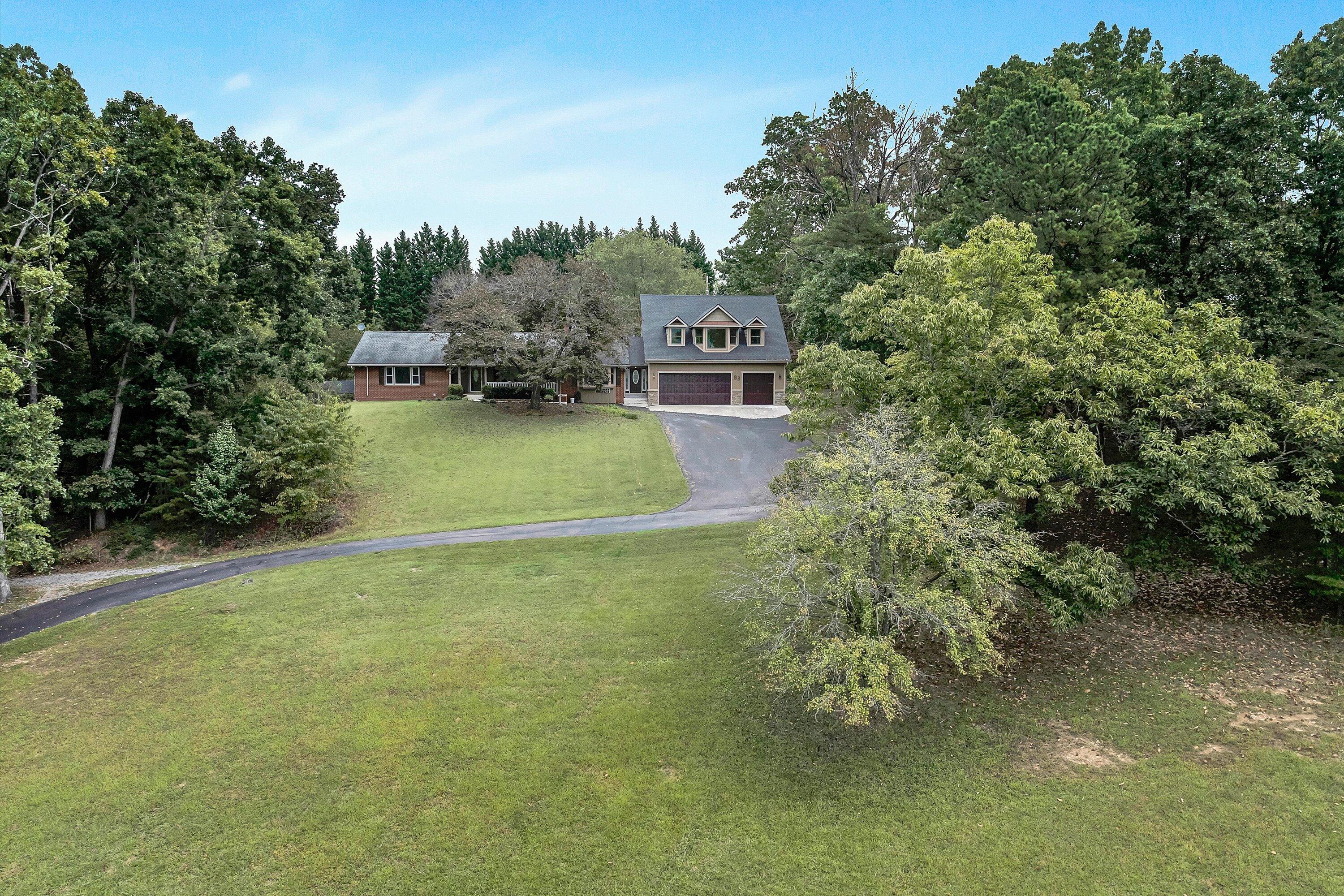 83 Springview Court Troutville, VA 24175 - Photo 62 of 74 a aerial view of a house with a yard basket ball court and outdoor seating