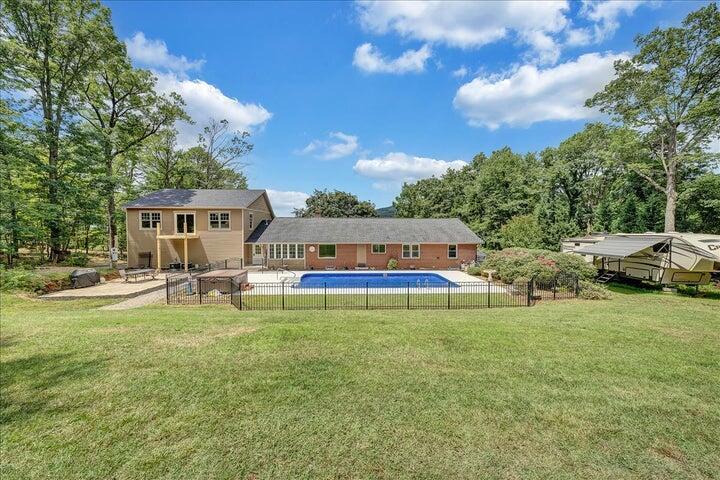 83 Springview Court Troutville, VA 24175 - Photo 68 of 74 a view of swimming pool with lawn chairs and large trees