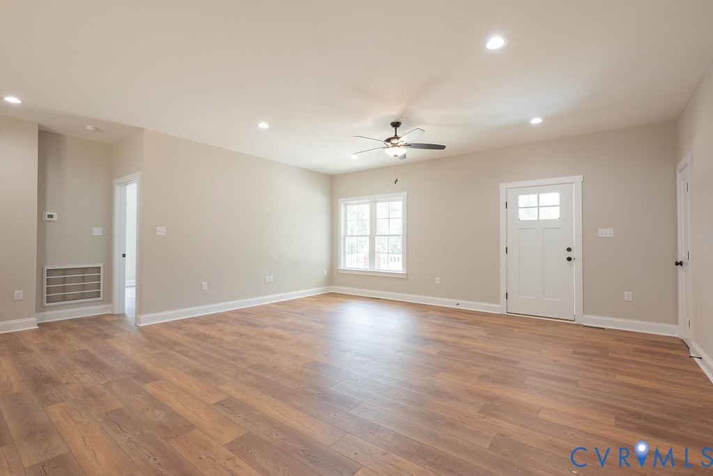 2349 Wickham Road Bumpass, VA 23024 - Photo 12 of 47 Unfurnished living room featuring a ceiling fan, r