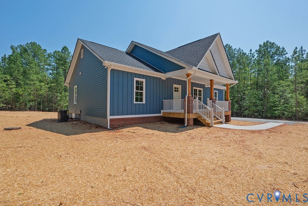 2349 Wickham Road Bumpass, VA 23024 - Photo 2 of 47 View of front facade featuring a porch, board and