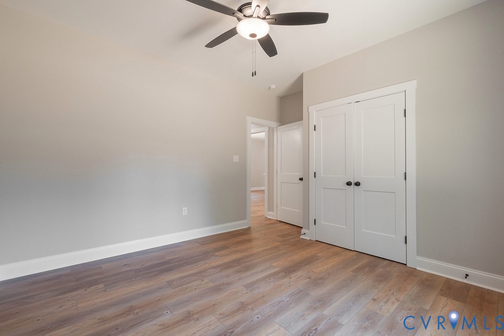 2349 Wickham Road Bumpass, VA 23024 - Photo 25 of 47 Unfurnished bedroom featuring wood finished floors