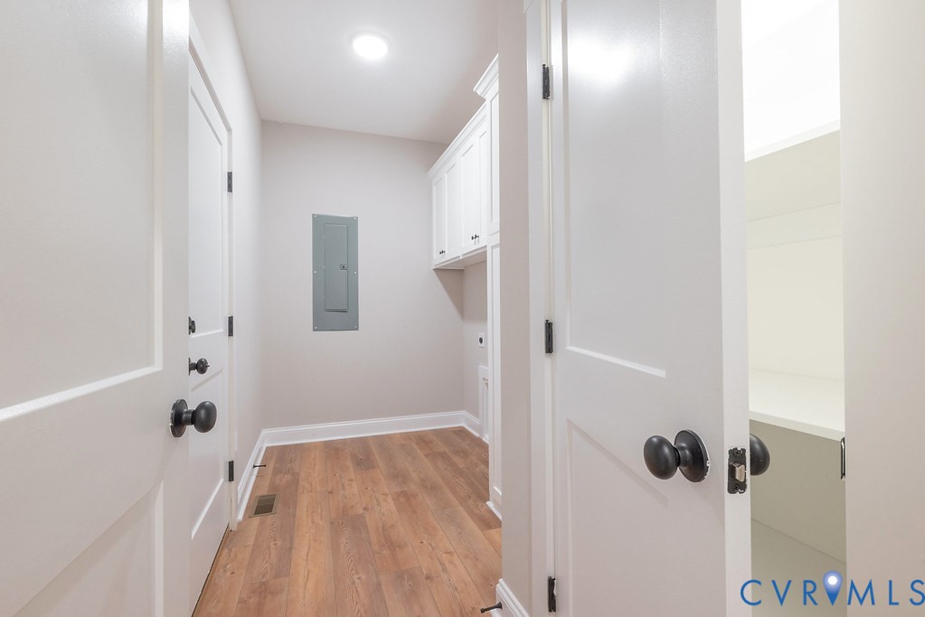 2349 Wickham Road Bumpass, VA 23024 - Photo 31 of 47 Washroom with light wood-style floors and electric