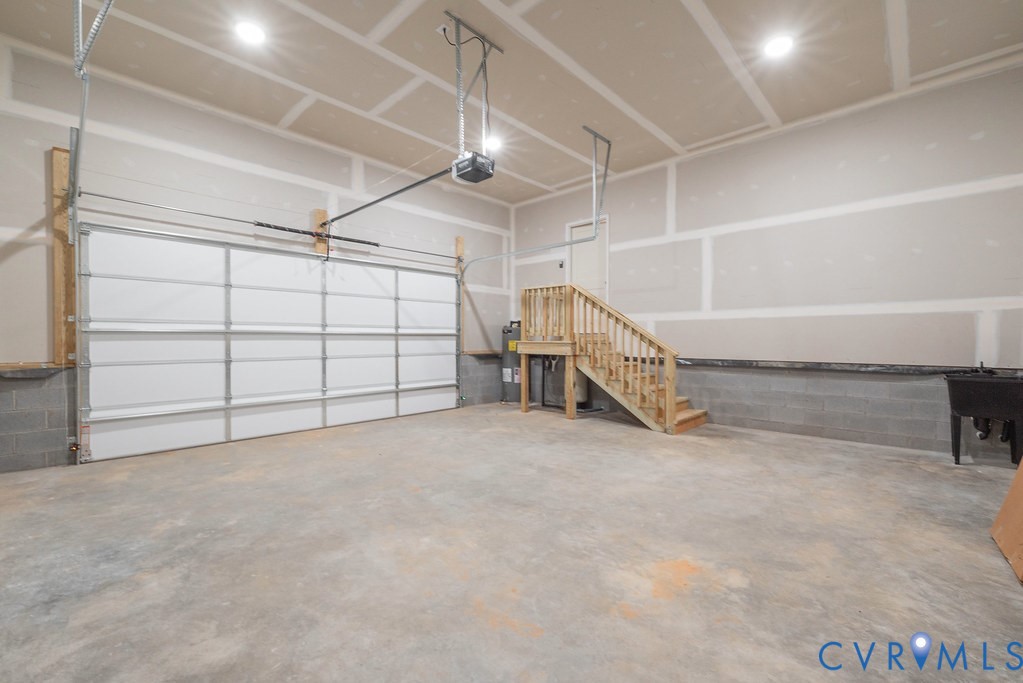 2349 Wickham Road Bumpass, VA 23024 - Photo 32 of 47 Garage featuring concrete block wall, a garage doo