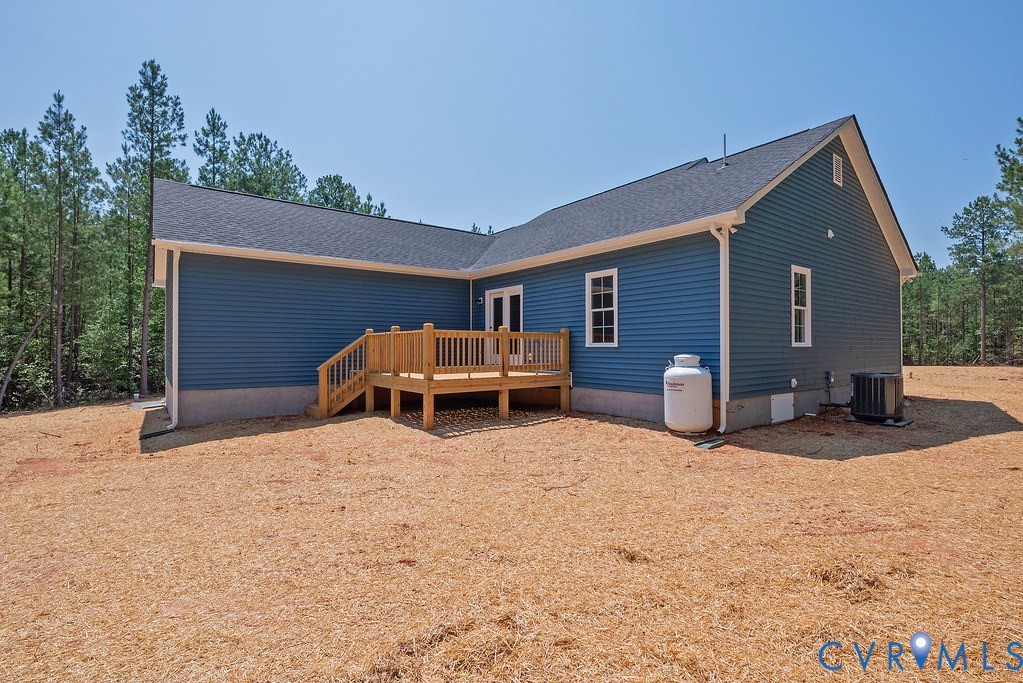 2349 Wickham Road Bumpass, VA 23024 - Photo 35 of 47 Back of property featuring a deck, roof with shing
