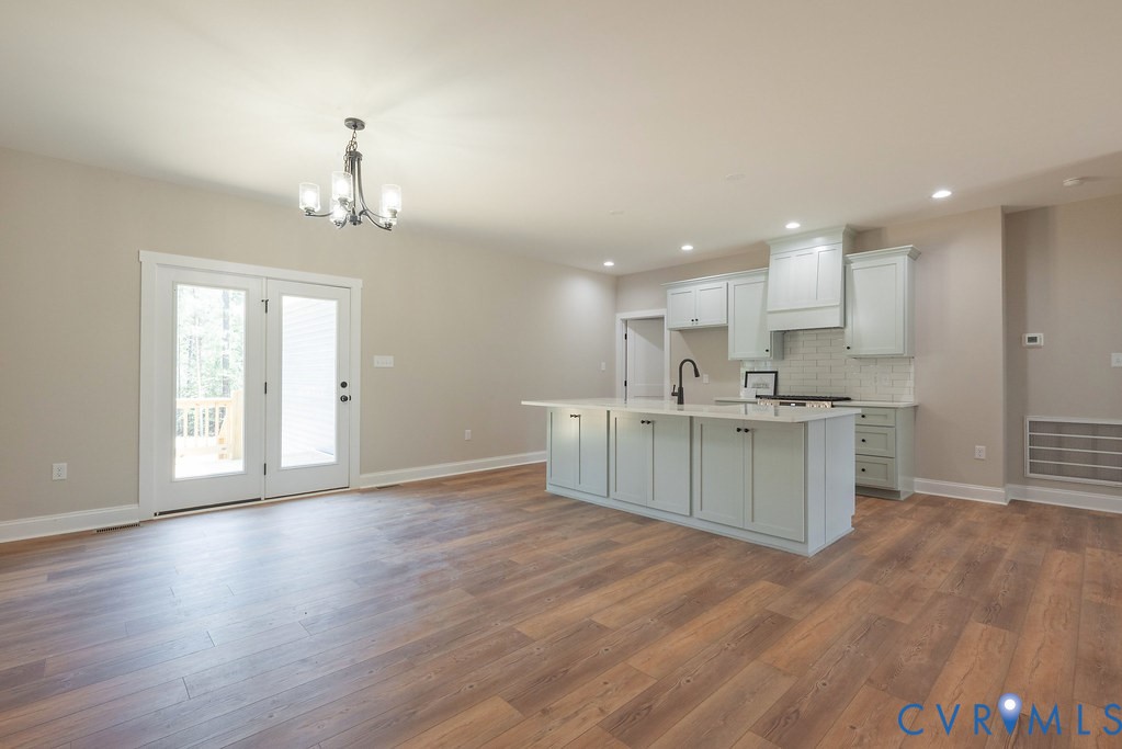 2349 Wickham Road Bumpass, VA 23024 - Photo 41 of 47 Kitchen featuring a chandelier, wood finished floo